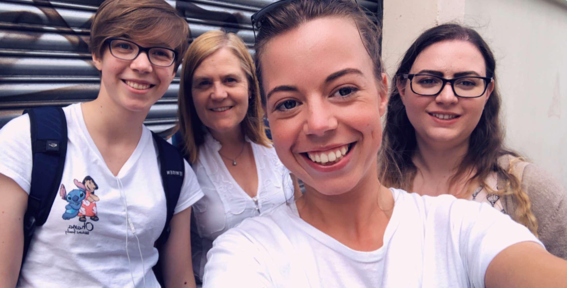 Four women take a selfie outside the Secret Studio Escape Room in London.