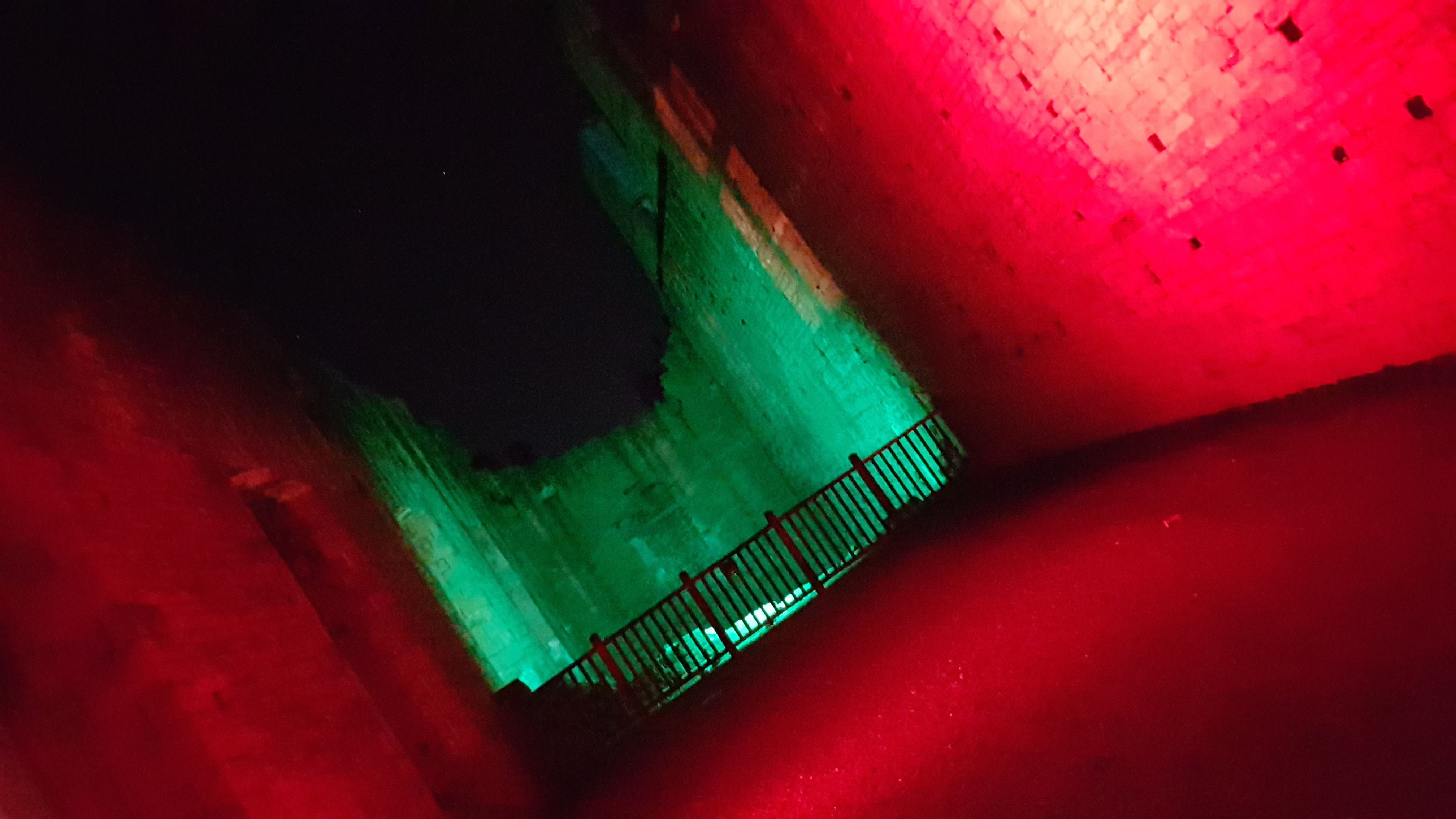 Ruins of Bolsover Castle. Spooky corridor with red and green lighting at night