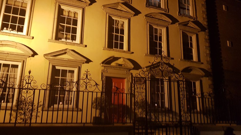 One of the stops on the ghost tour, a white fancy looking house with a metal gate