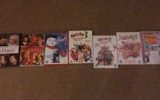 DVD boxes of Christmas films layed out. The films are The Holiday, Noel, Jack Frost, Nativity! Nativity 2, Nativity 3 and Phineas and Ferb the movie.