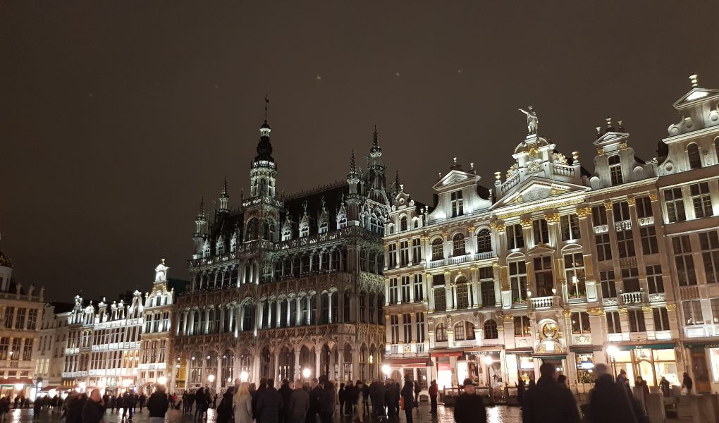 Grand Place in Brussels. A night scene with large ornate buildings lit up