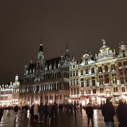 Grand Place in Brussels. A night scene with large ornate buildings lit up