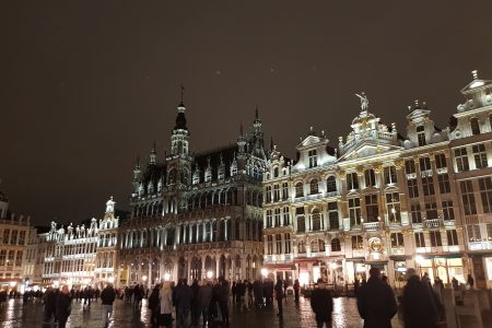 Grand Place in Brussels. A night scene with large ornate buildings lit up