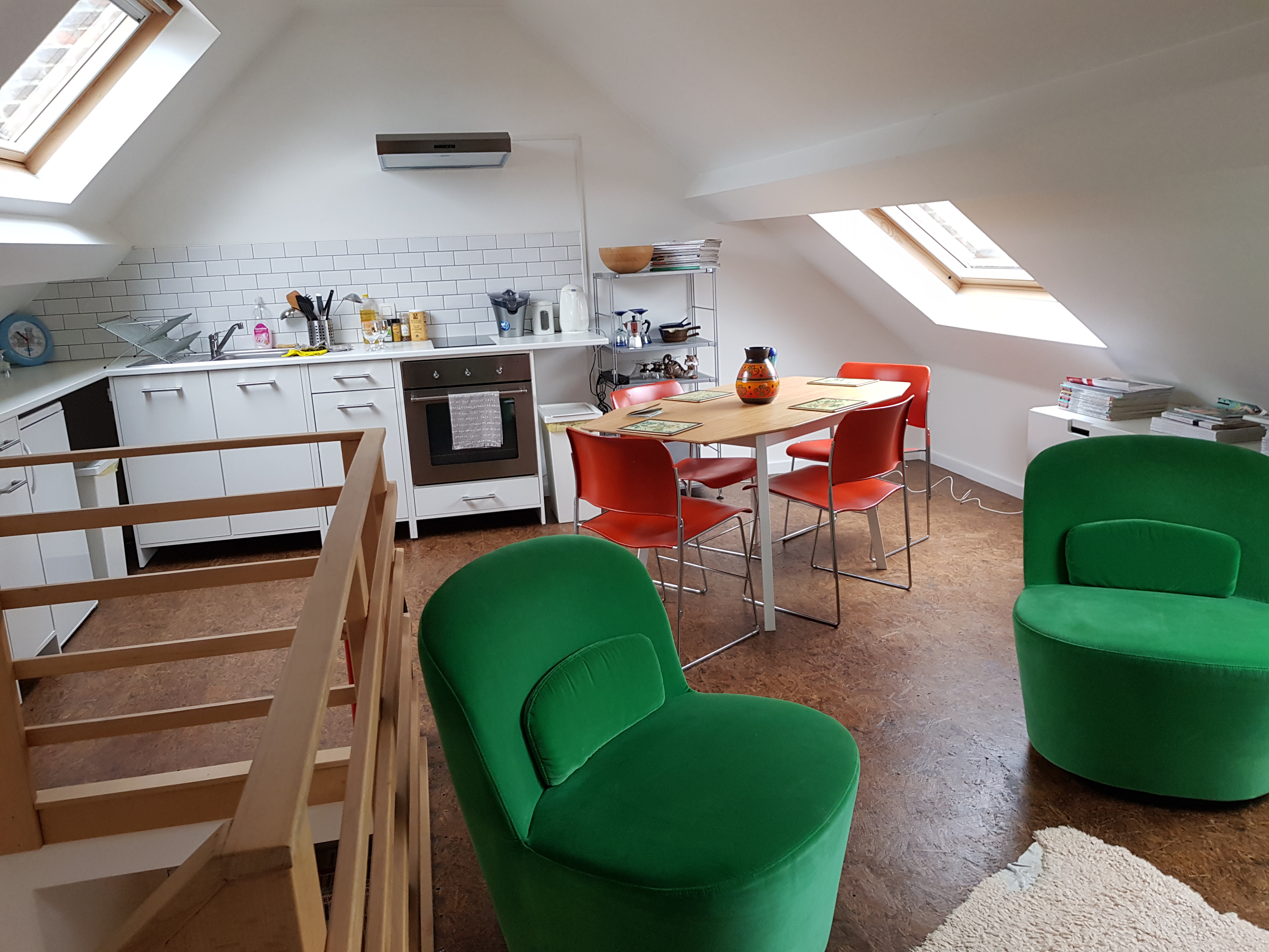 The kitchen, dining and living area in the upstairs area of the airbnb
