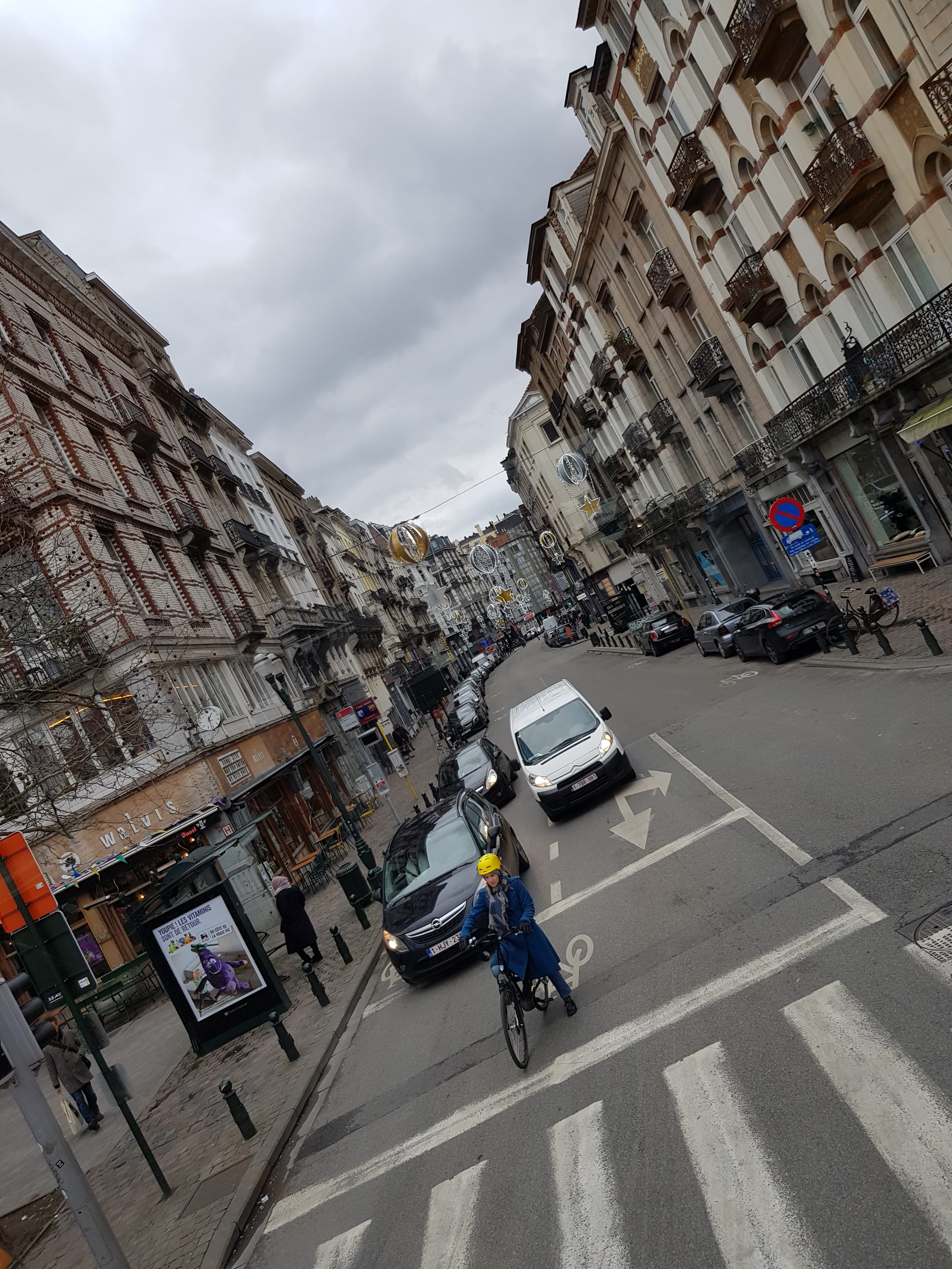 Photo of a street lined with tall town house buildings