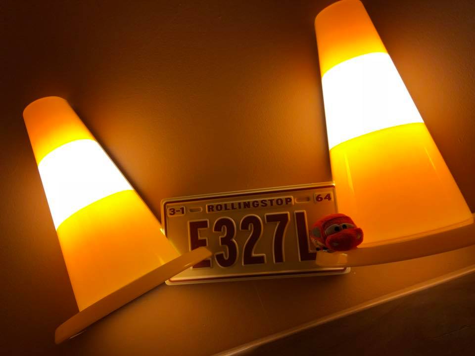 Lights in the Hotel Santa Fe at Disneyland Paris designed to look like traffic cones with a registration plate between. The Licence reads E327L