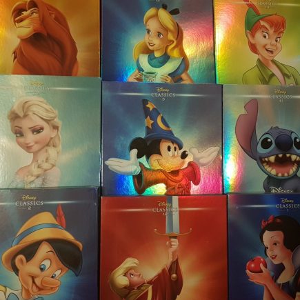 Shiny DVD boxes for Disney DVDs. Lion King, Alice in Wonderland, Peter Pan, Frozen, Fantasia, Lilo and Stitch, Pinocchio, The Sword in the Stone and Snow White
