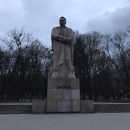 statue of an older man in a park in L'viv, Ukraine