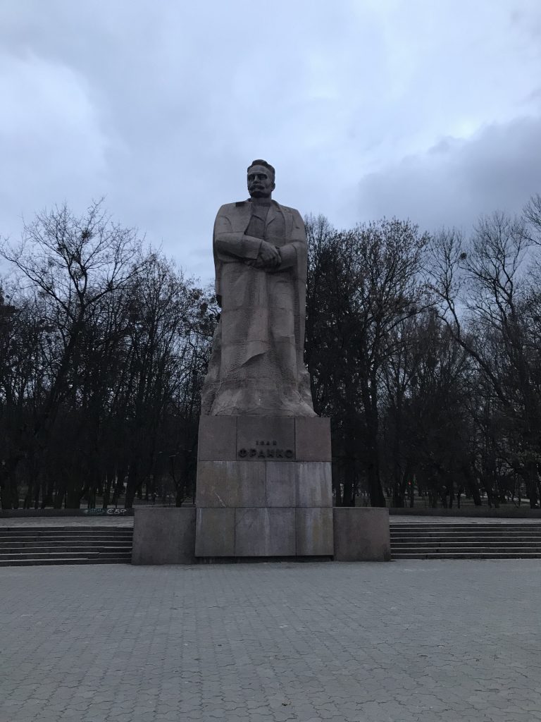 statue of an older man in a park in L'viv, Ukraine