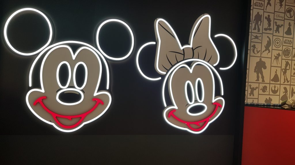 Neon Mickey and Minnie mouse signs in the Primark Disney Cafe