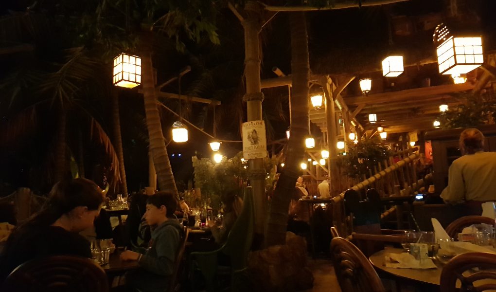 Inside the Disneyland Paris Restaurant, Captain Jack's. Designed like the inside of a jungle with wooden beams, green leaves and hanging lanterns.