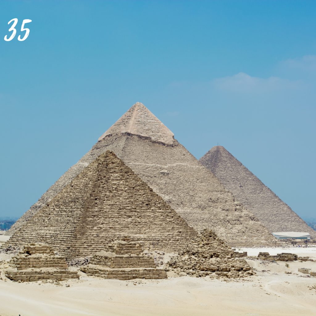 Number 35. The Pyramids of Giza, large sandstone pyramids in the desert.