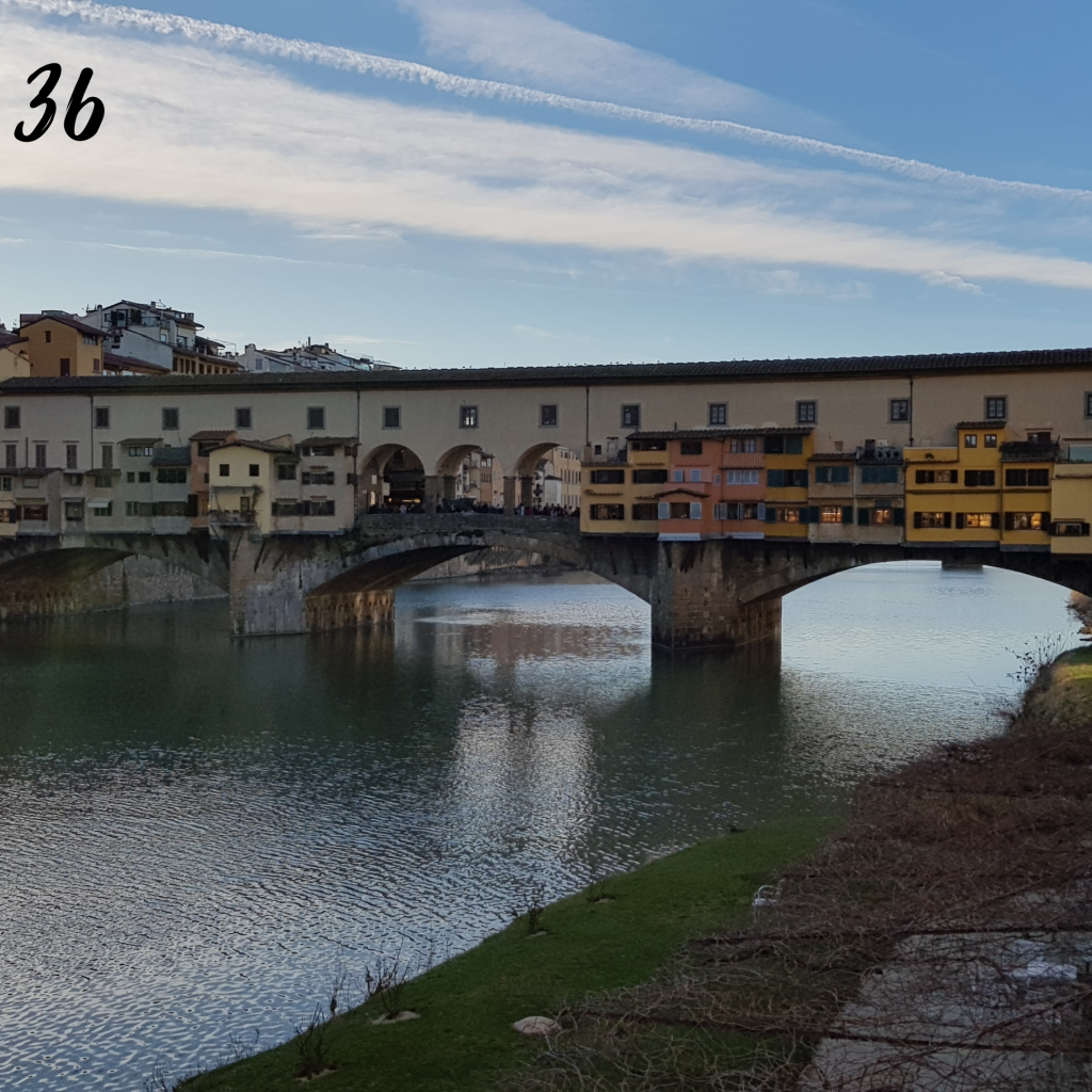 Number 36. Ponte Vecchio bridge over the river with shops along it.